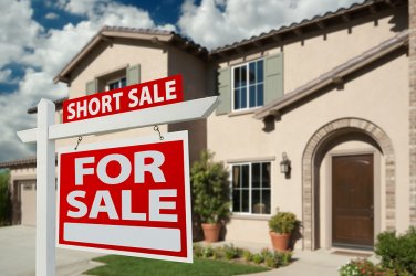 Short Sale Real Estate Sign and House